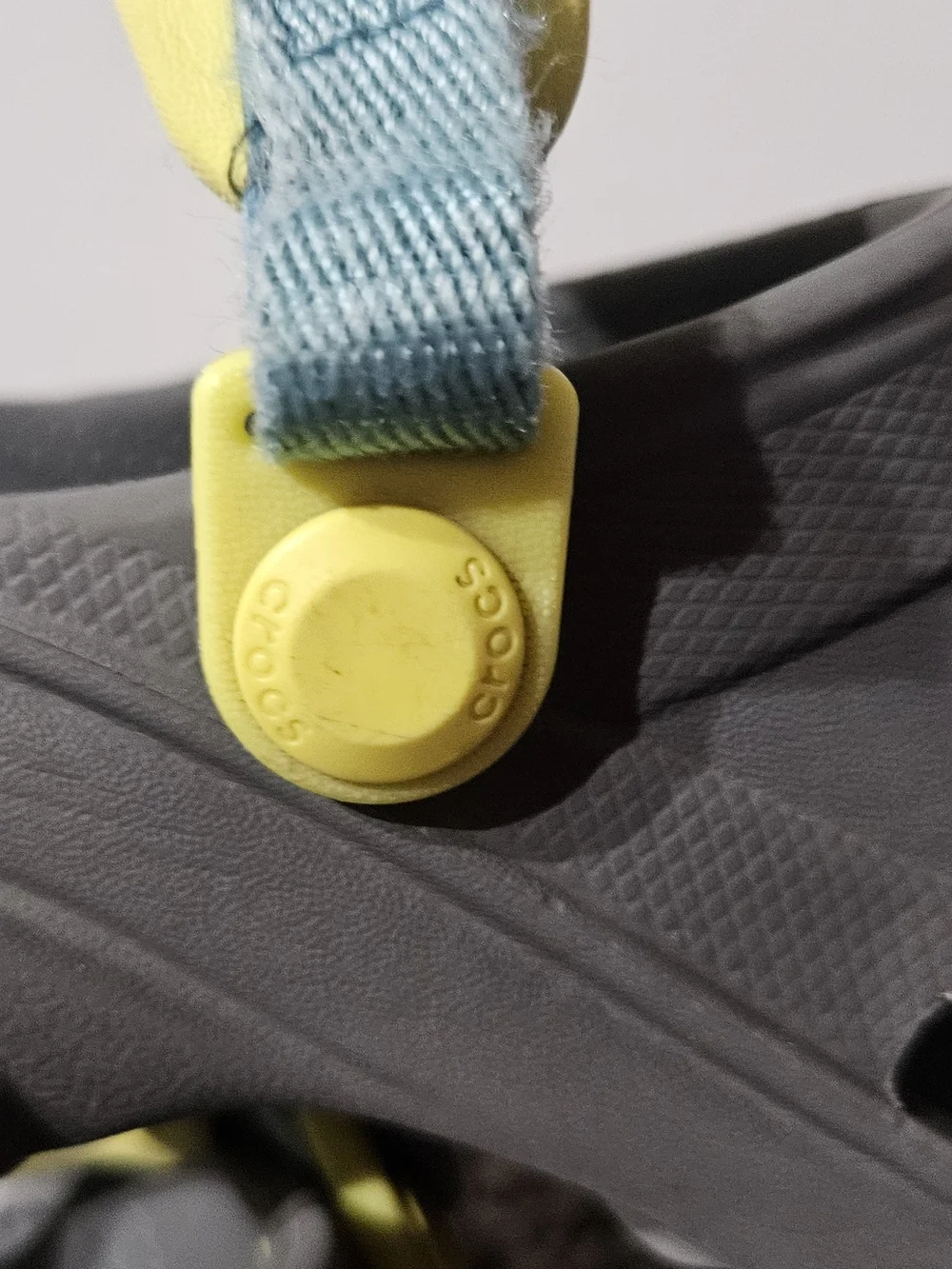 CROCS Kids Gray Clogs with Yellow and Blue Accents
